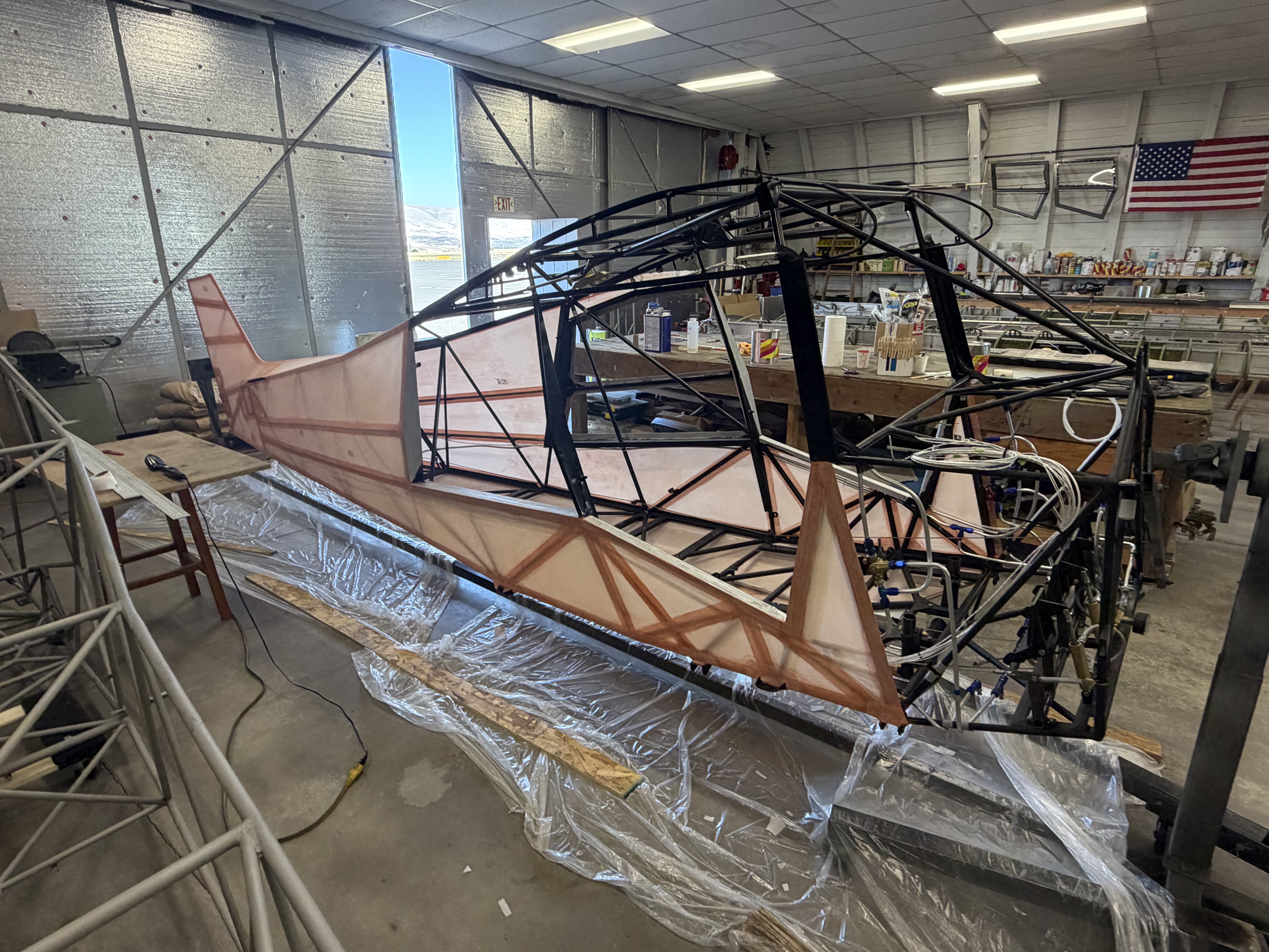 Experimental Super Pacer fuselage — full-length side view in the hangar